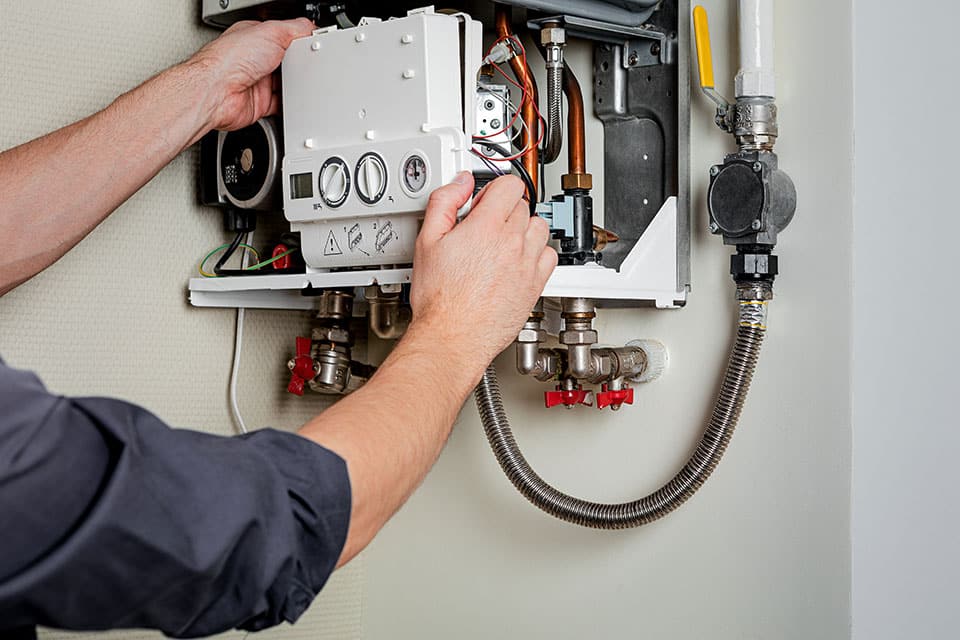 a man is repairing boiler in Vancouver