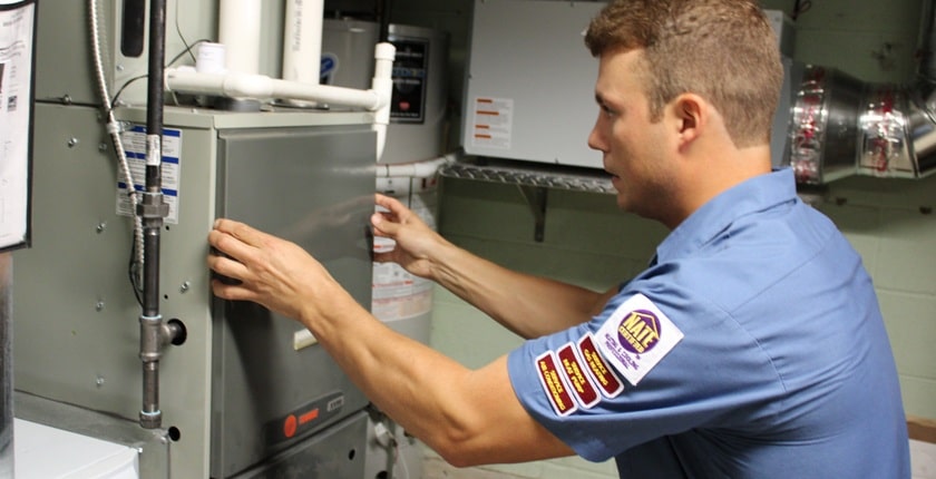 Furnace Repair Cost Vancouver — Vanheat Services licensed technician repairing a furnace