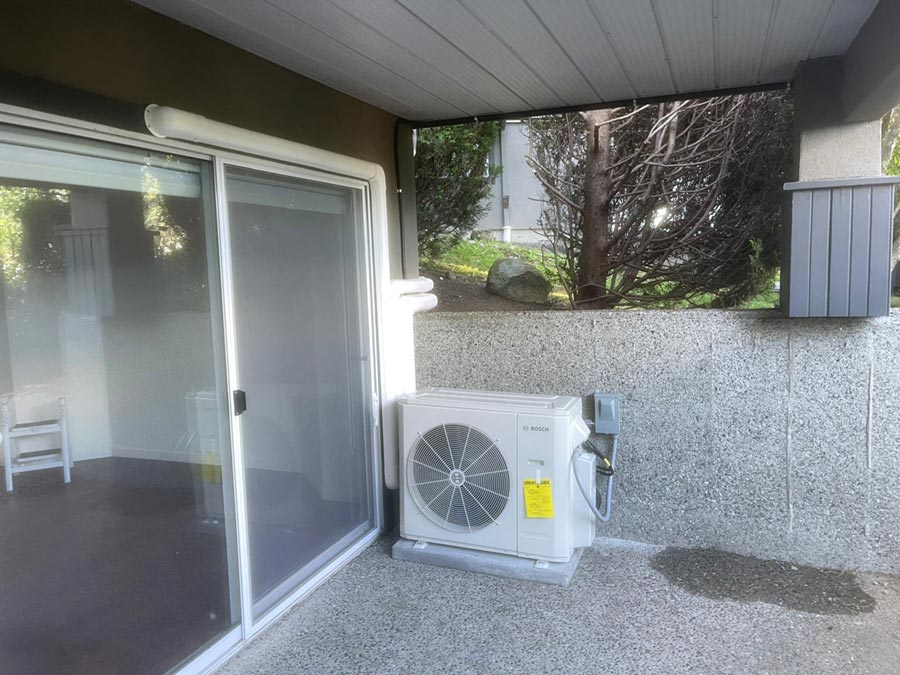 Professional heat pump installation showcasing cooling system choice for Vancouver homes. Best Cooling System options