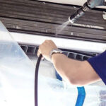 Technician performing regular mini-split cleaning at Vanheat Services