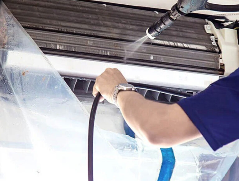 Technician performing regular mini-split cleaning at Vanheat Services