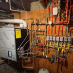Technician performing a home boiler upgrade for improved efficiency. Home Boiler Upgrade