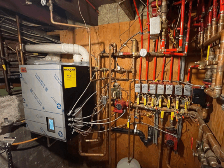 Technician performing a home boiler upgrade for improved efficiency. Home Boiler Upgrade