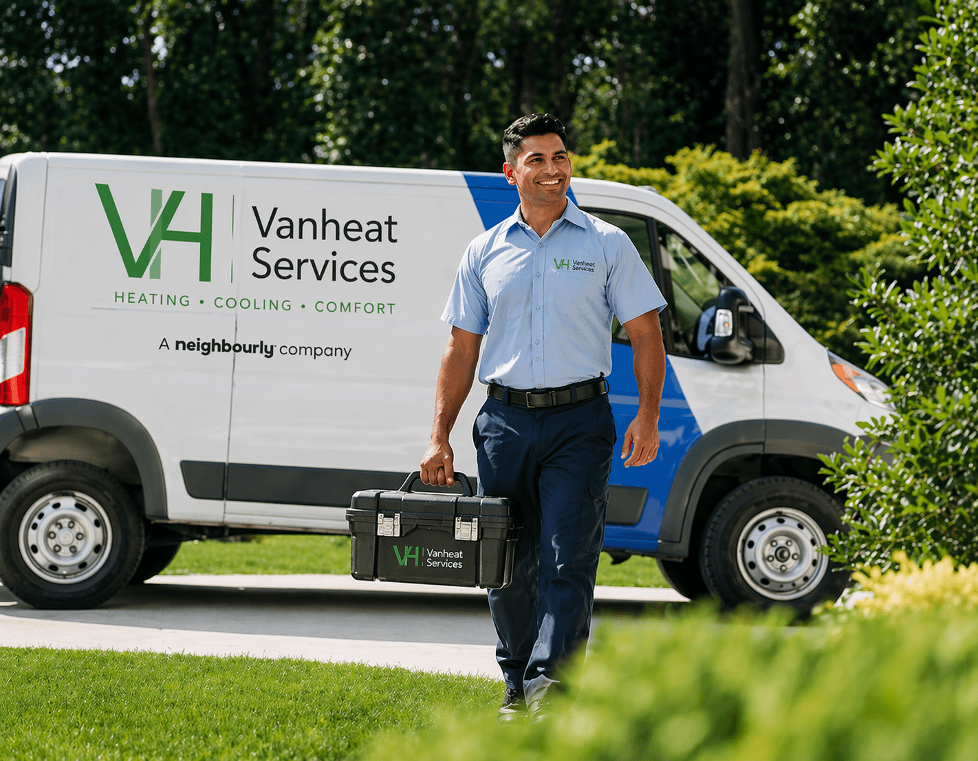 Vanheat Services technician with branded service van providing heating services across Metro Vancouver